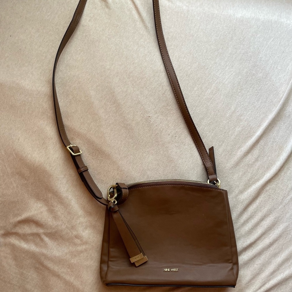 Nine West tan crossbody bag. 3 compartments.